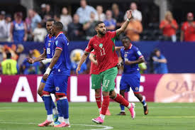 احتفال لاعبي منتخب المغرب بالفوز والتأهل لدور الـ 32 في كأس العالم